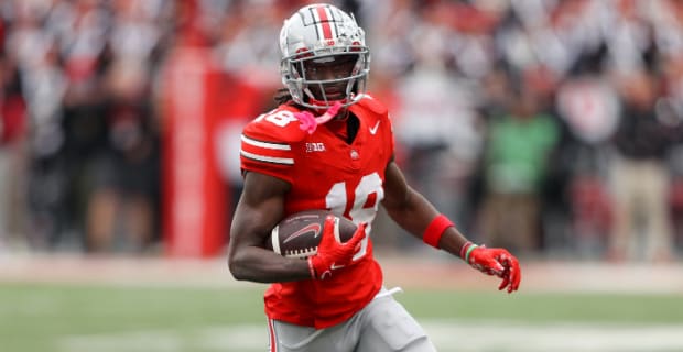 Ohio State Buckeyes wide receiver Marvin Harrison, Jr. catches a pass during a college football game in the Big Ten.